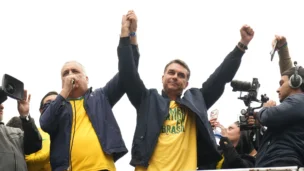 O senador Flávio Bolsonaro, candidato à presidência da República, com vice Alfredo Gaspar